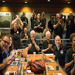 Part of the New Horizons team celebrating the spacecraft's flyby of Pluto